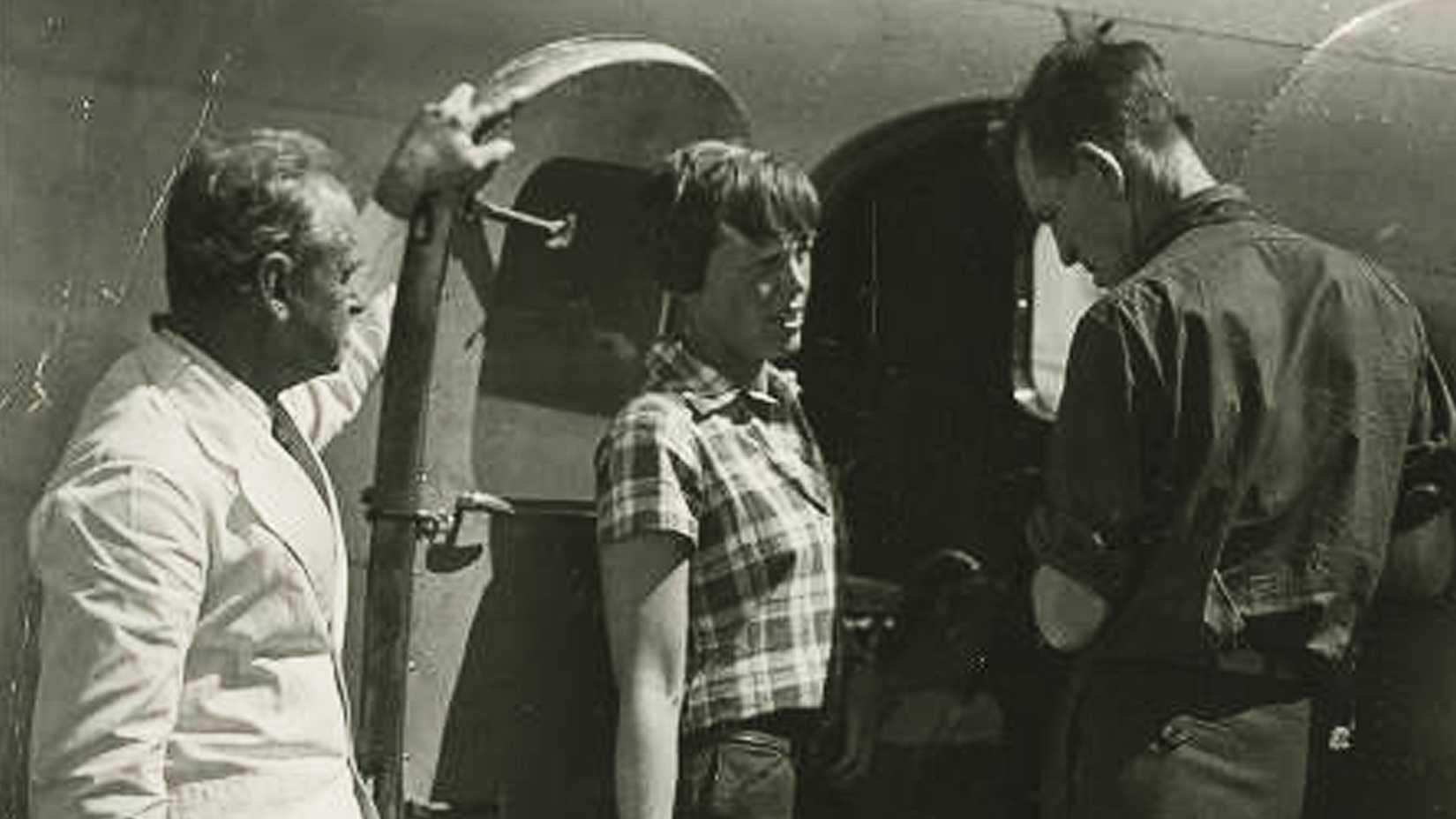 Amelia Earhart stands between two men beside her Lockheed Electra in Darwin, Australia, on June 28, 1937, days before her disappearance.