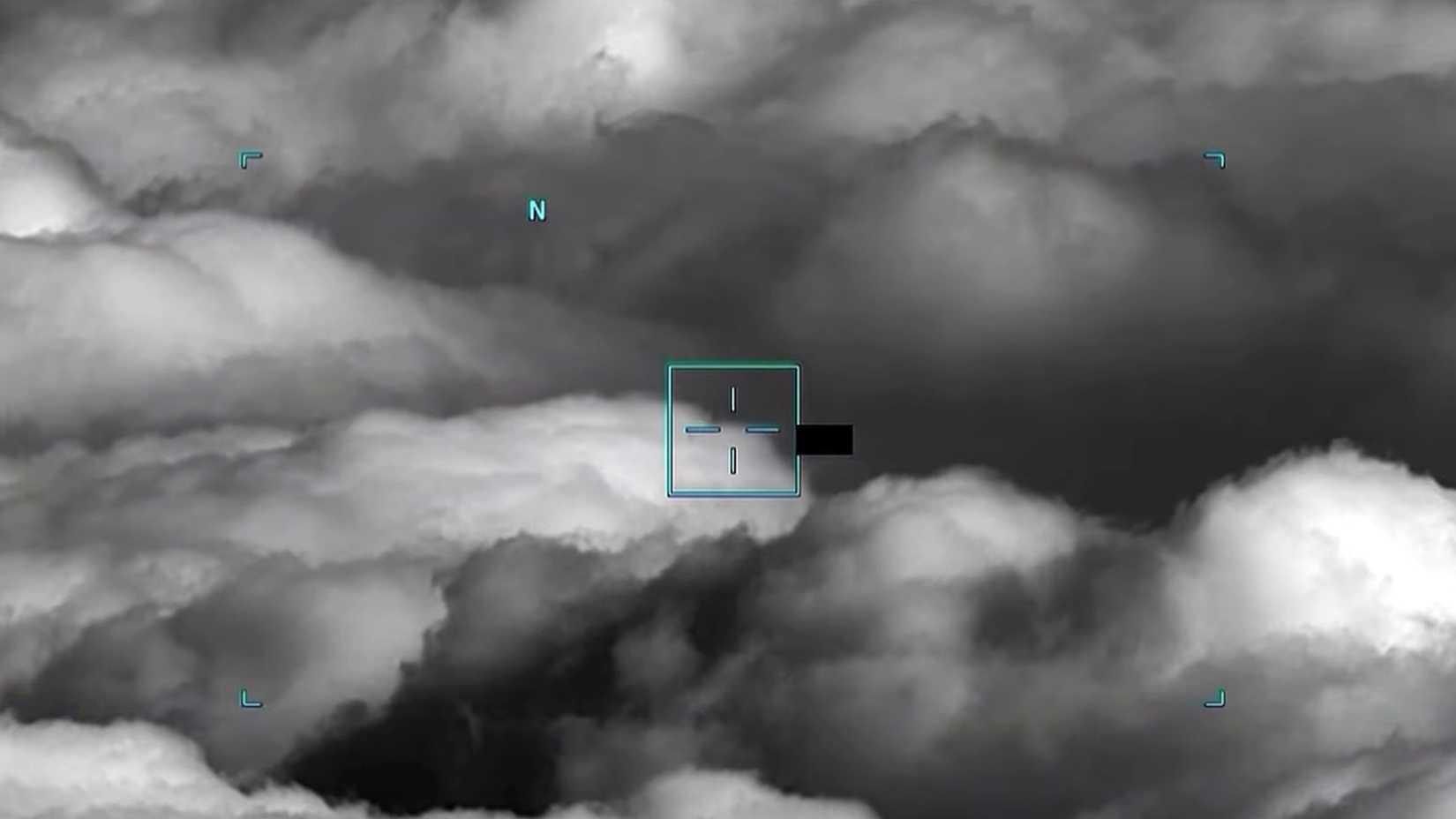 Infrared military footage shows an unidentified object tracked over clouds in the Yellow Sea in 2023.