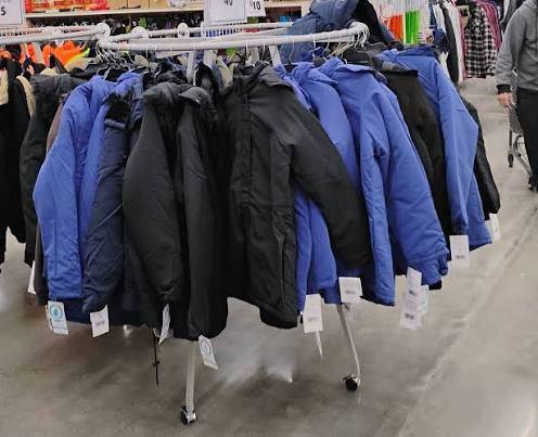 Rack of winter coats sold by Ocean State Job Lot as part of Buy-Give-Get Coats Program. (OSJL).