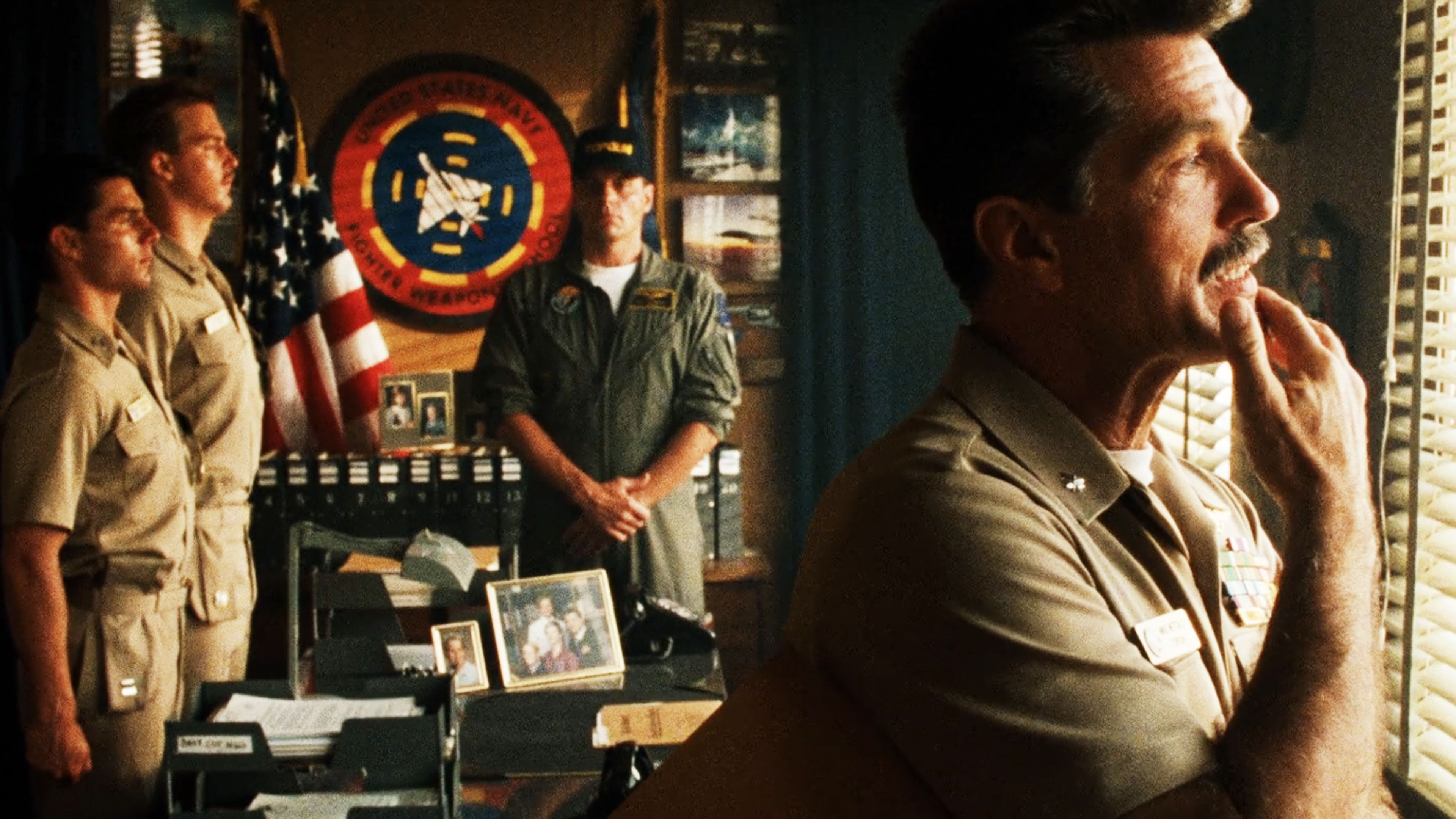 Tom Skerritt as Cmdr. Mike "Viper" Metcalf stands near an office window in uniform during a scene from the 1986 film Top Gun.